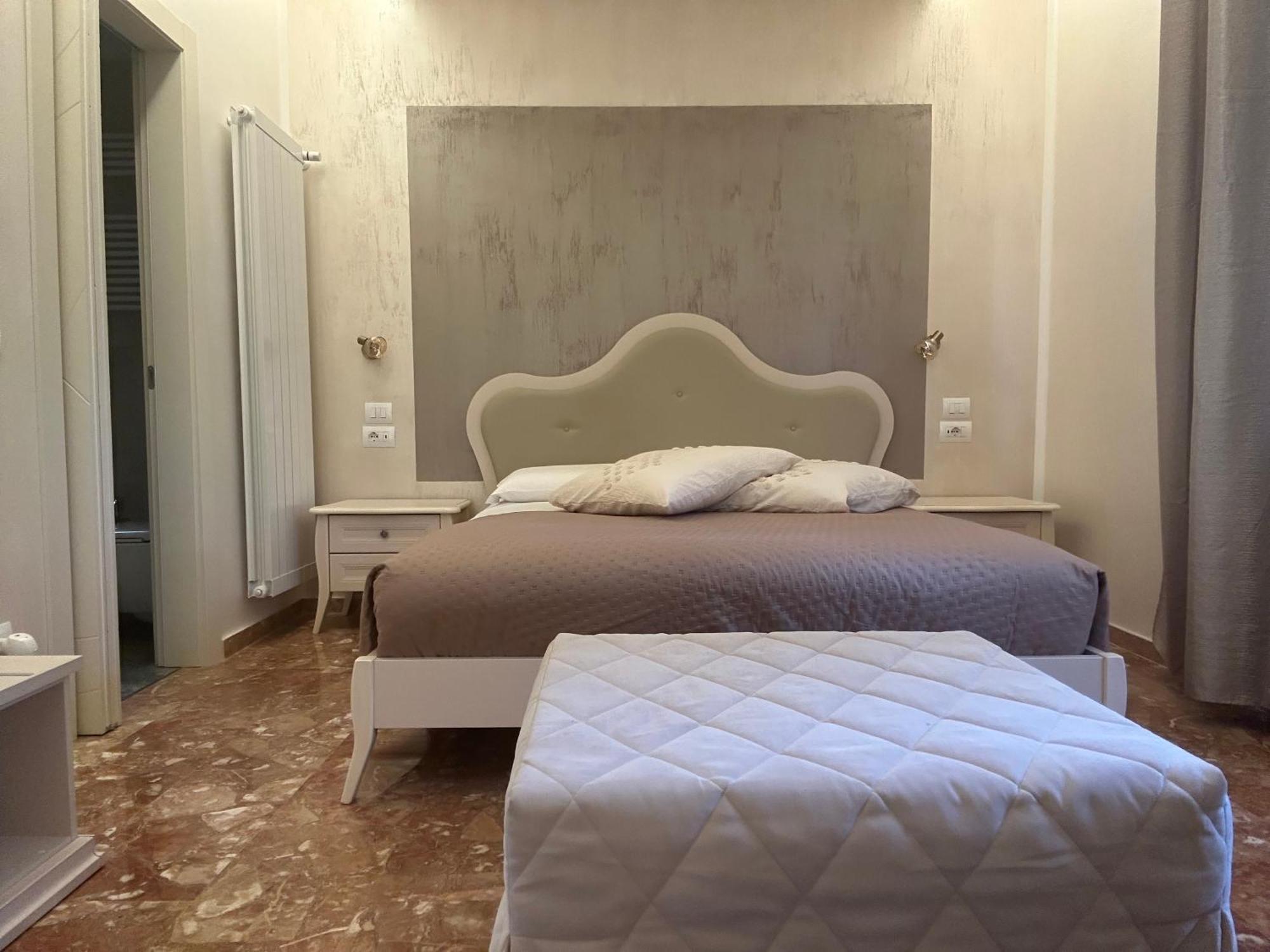 Camera Matrimoniale Deluxe (2 Adulti + 1 Bambino)